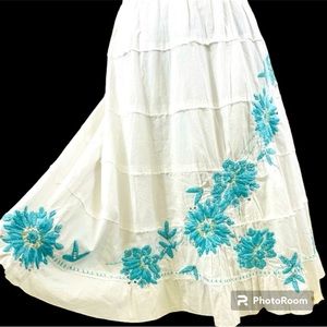 White hand embroidered turquoise flowers size 12 knee length embellished & lined